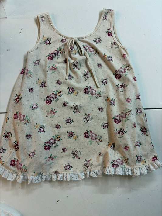 3T Omi Jo floral dress on cream background with pockets and lace detail at bottom
